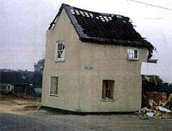 The Barley Mow undergoing demolition - front cover of The Meppershall Messenger April 2010